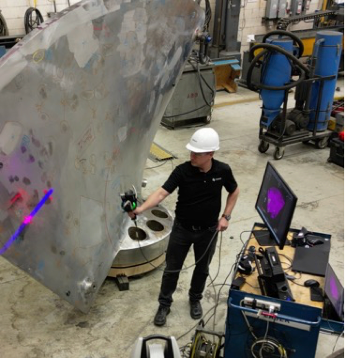 NDT technician performing optical scan to capture surface data for digital twin inspection