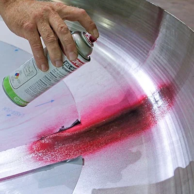 Fluorescent penetrant indication visible under ultraviolet light