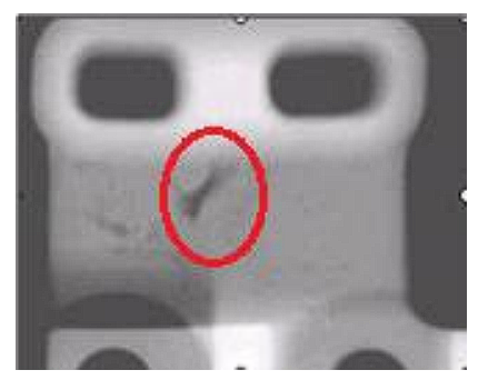 Radiograph showing a detected defect highlighted in a tested component